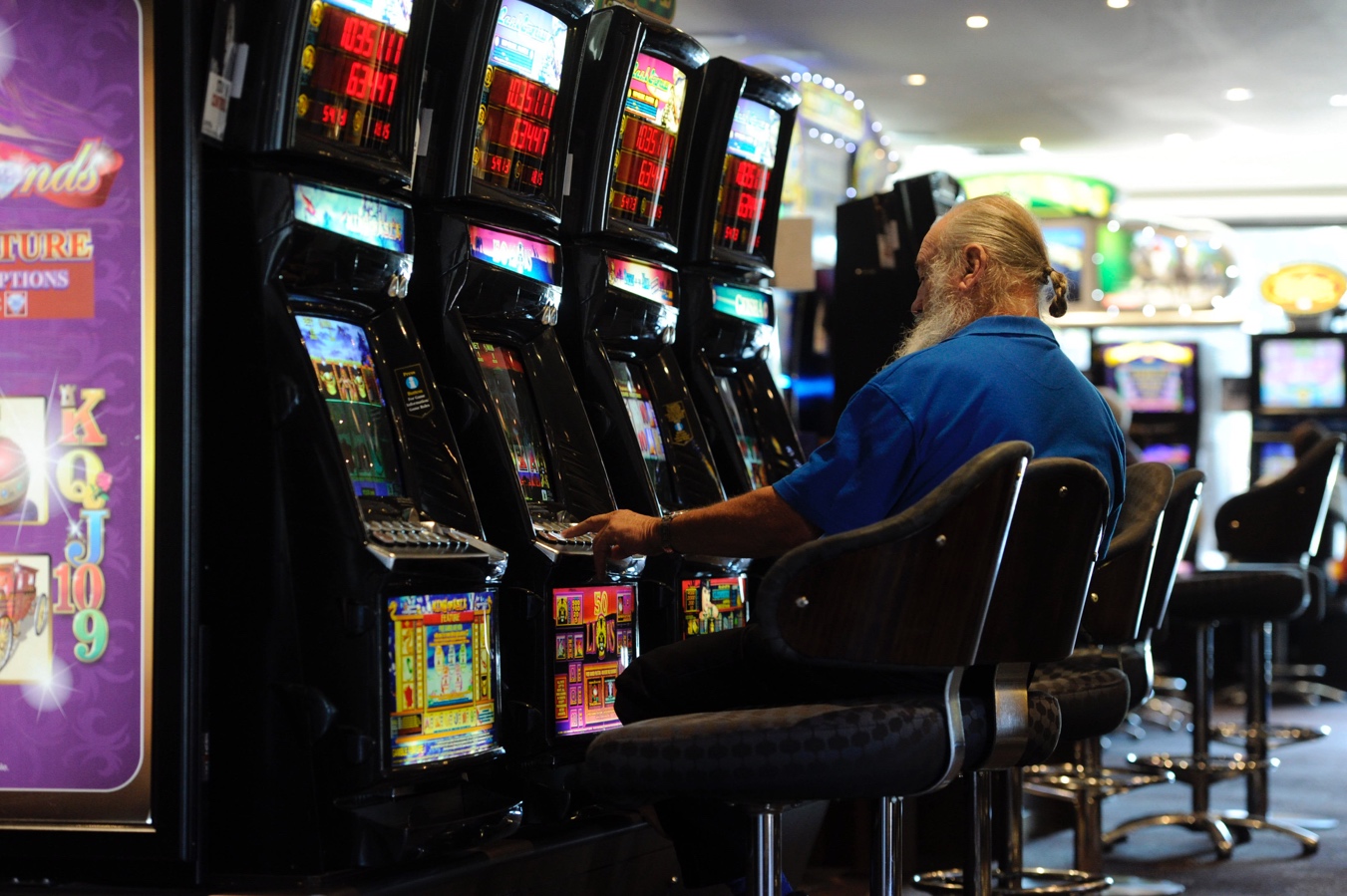 Pokies players lose record $301 million in a month